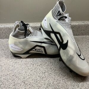 Nike Alpha High-Top Cleats in Black and White